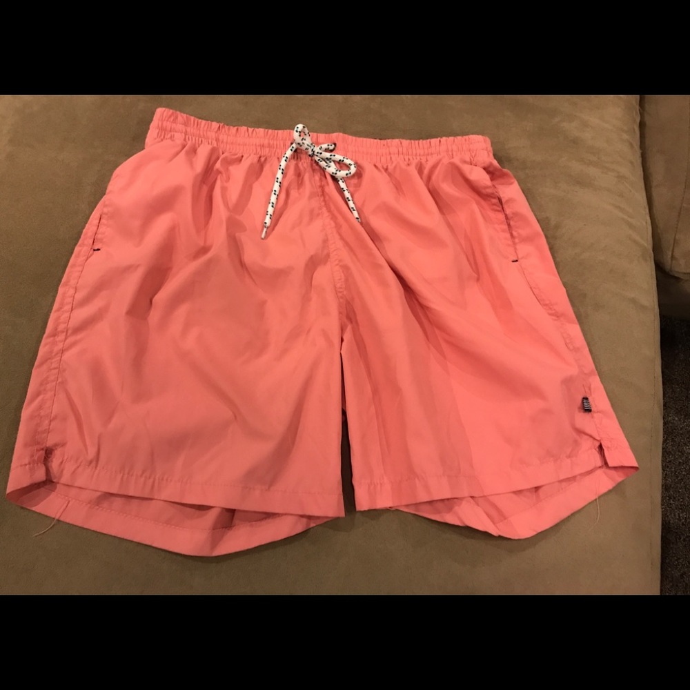 2/MEN lined orange swimming trunks.